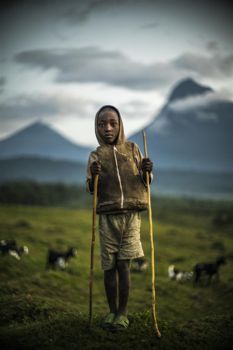 Goatherder and Mount Mikeno